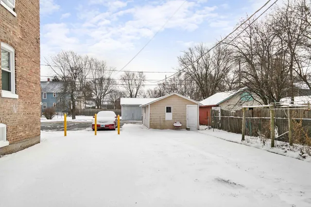 a view of a house with a snow in the yard