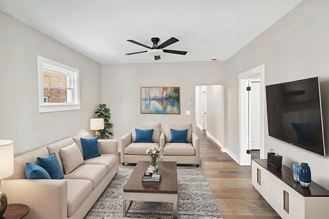 a living room with furniture and a flat screen tv