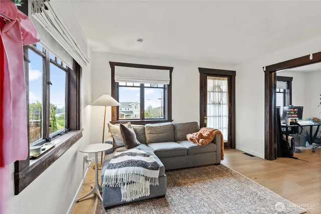 a view of a room that has a table and a window