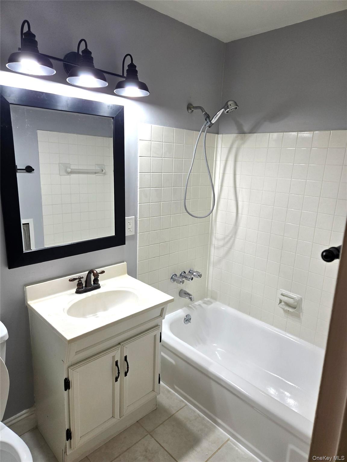 110 Sterling Street, Unit 110 Beacon, NY 12508 - Photo 7 of 14 a bathroom with a sink vanity and a mirror