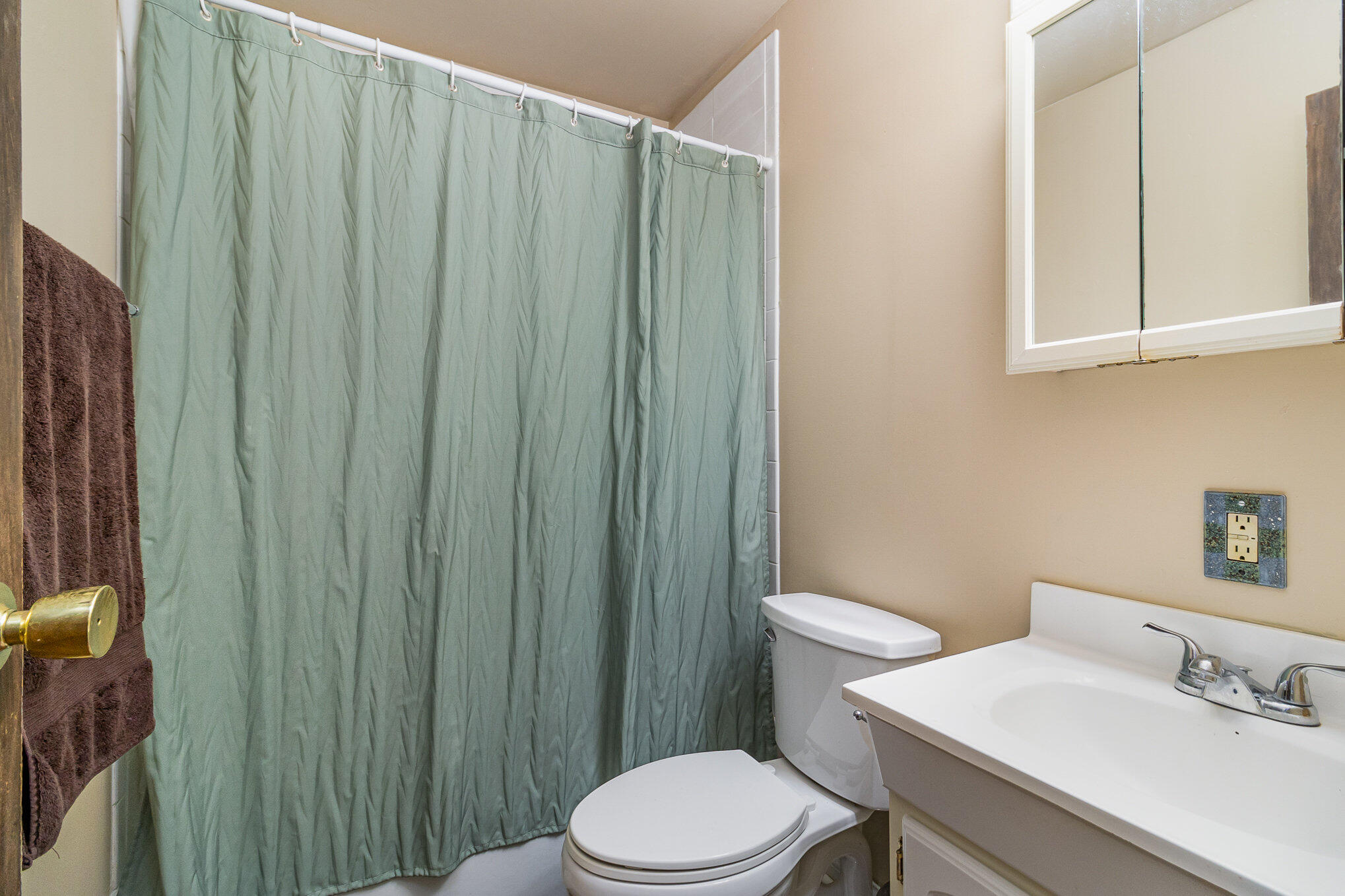 3614 Windsor Road Michigan City, IN 46360 - Photo 15 of 19 a white toilet sitting next to a bathroom sink