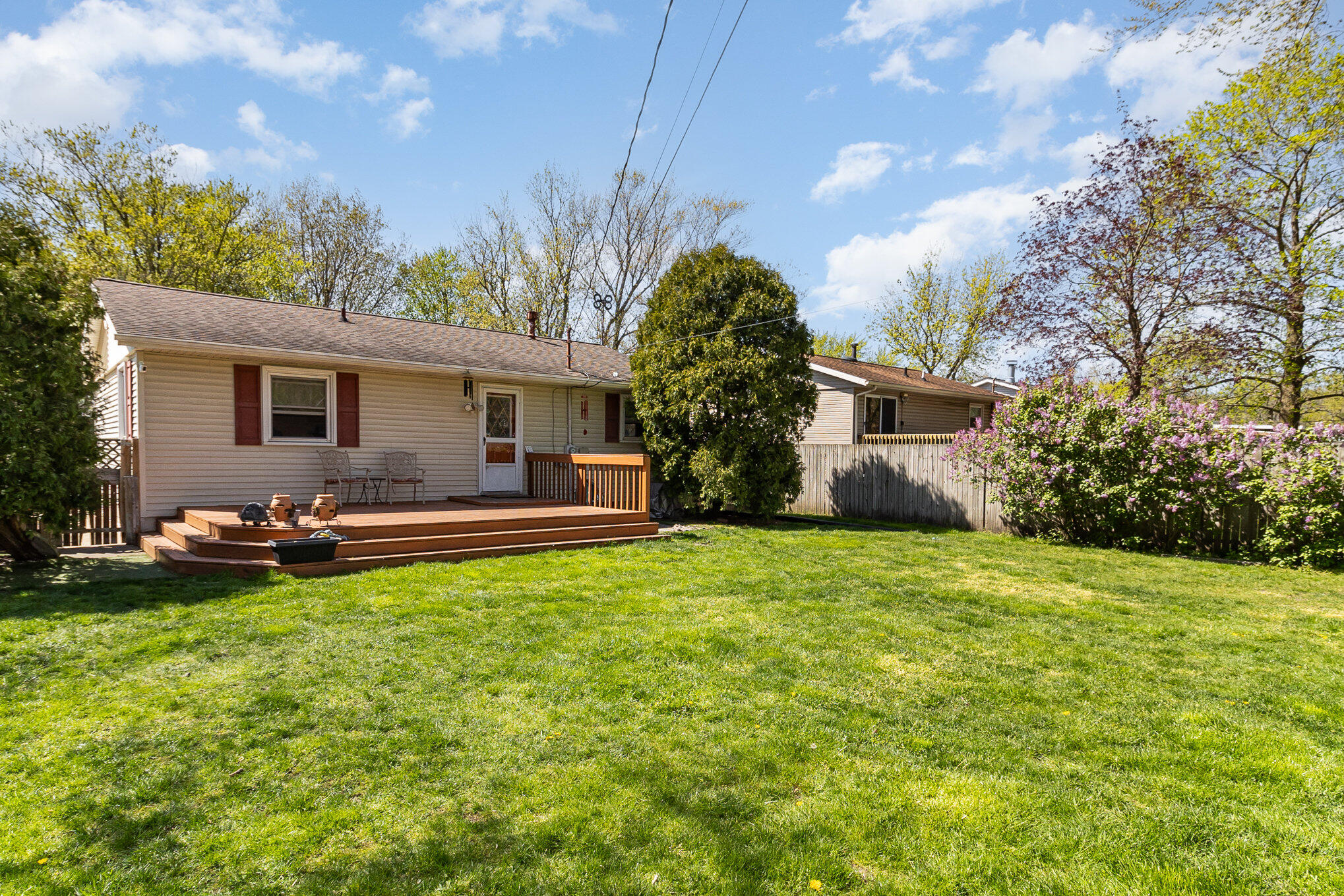3614 Windsor Road Michigan City, IN 46360 - Photo 2 of 19 a view of a house with backyard and sitting area