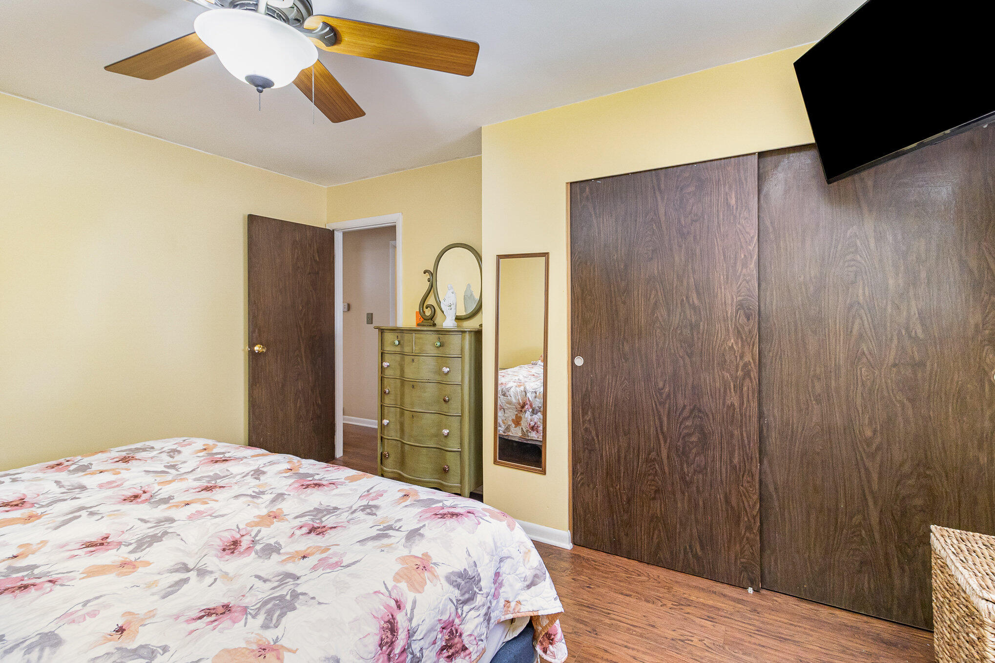 3614 Windsor Road Michigan City, IN 46360 - Photo 10 of 19 a bedroom with a bed and a chandelier