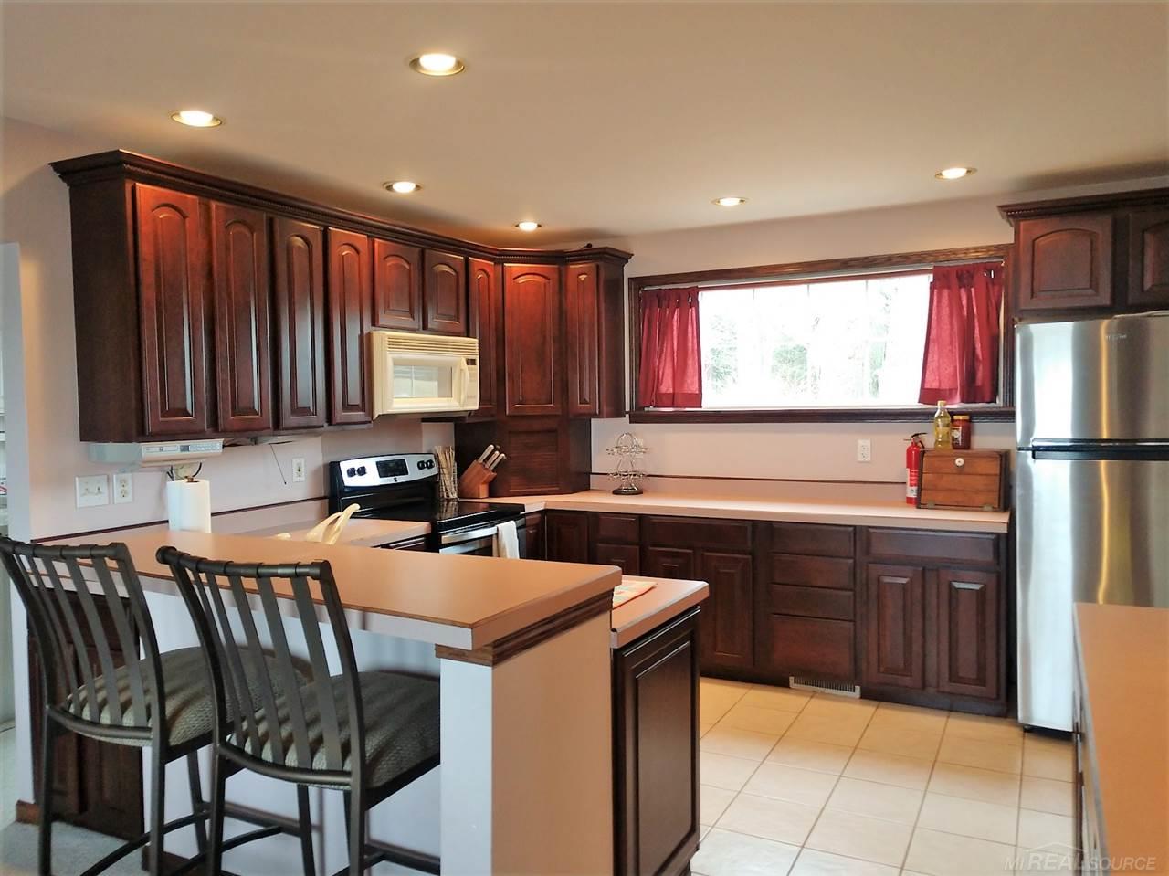 4604 Lakeshore Road Deckerville, MI 48427 - Photo 6 of 44 Very spacious/open kitchen with cherry cabinets