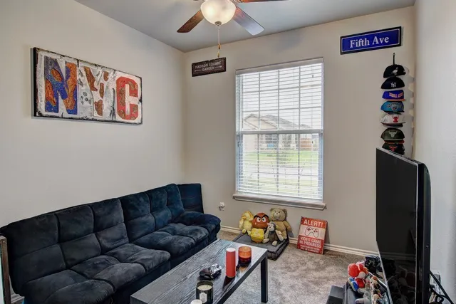 a living room with furniture and a window