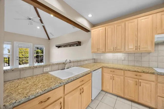 a bedroom with a bed a couch and a window