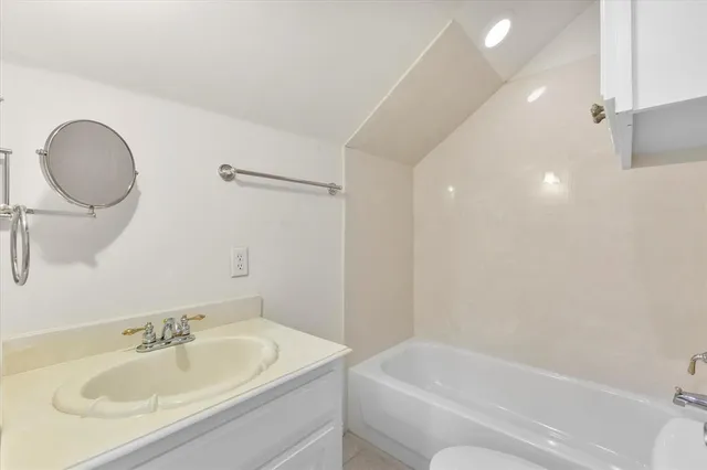 a view of a backyard with plants and a garden