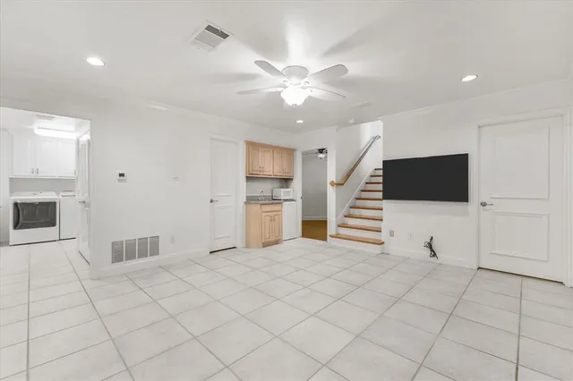 a view of a swimming pool with a patio and a yard