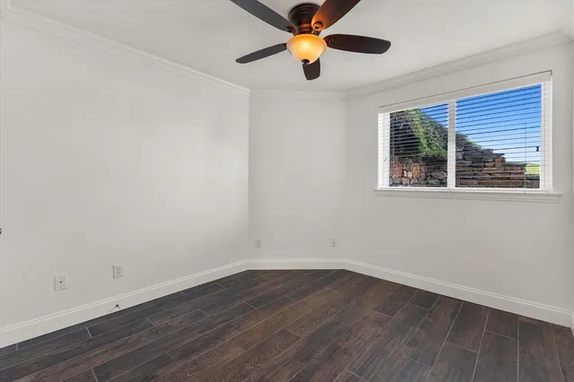 an aerial view of house with yard and ocean view