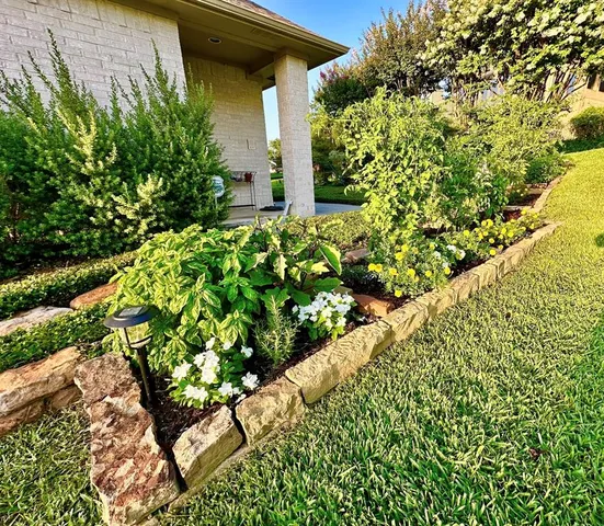a front view of a house with a yard table and chairs