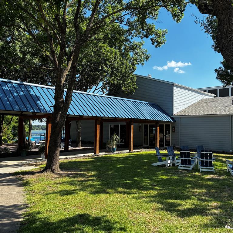 5411 Ranger Drive Rockwall, TX 75032 - Photo 28 of 33 a front view of a house with a yard table and chairs