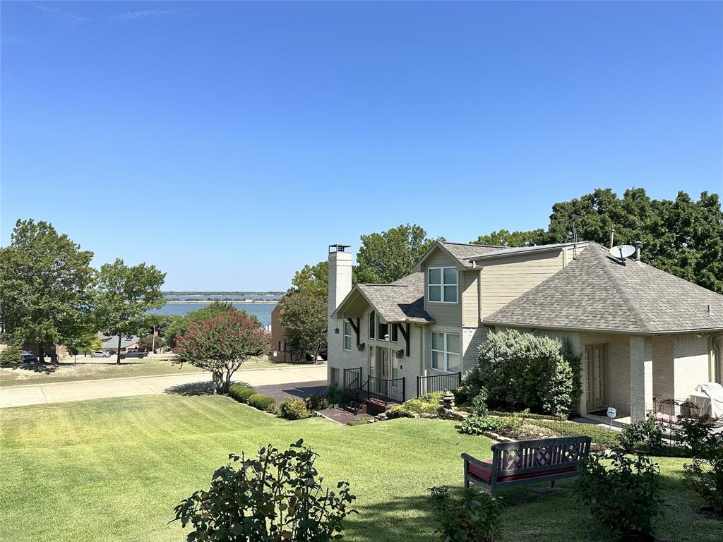 5411 Ranger Drive Rockwall, TX 75032 - Photo 5 of 33 a view of house with outdoor space and swimming pool