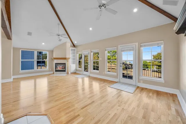 a view of a living room with a fireplace