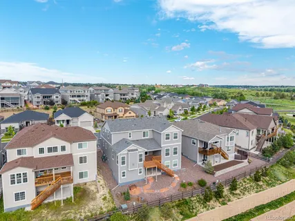 an aerial view of residential houses with outdoor space