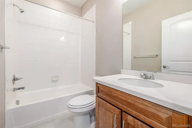 a bathroom with a sink a toilet and a bathtub