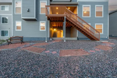 a backyard of a house with barbeque oven