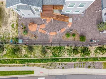 an aerial view of a house with a yard