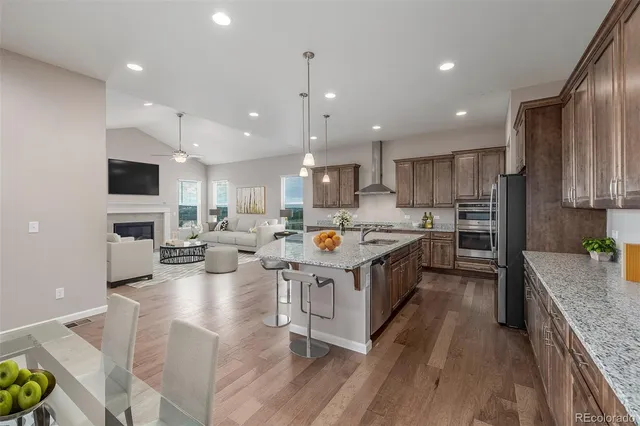 a large kitchen with stainless steel appliances granite countertop lots of counter top space