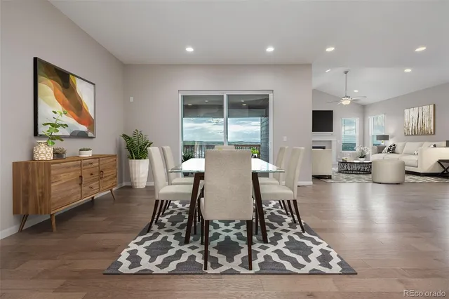 a view of a dining room with furniture window and wooden floor