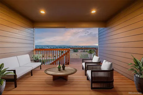 a outdoor living space with furniture and wooden floor