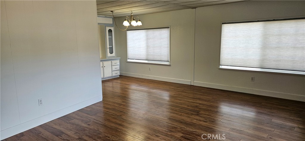 2920 Clark Road, Unit C12 Oroville, CA 95965 - Photo 5 of 17 a view of an empty room with wooden floor and a window