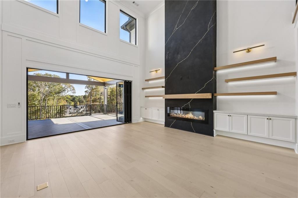 2395 Kilgore Road Buford, GA 30519 - Photo 12 of 68 a view of a livingroom with an empty space and a fireplace