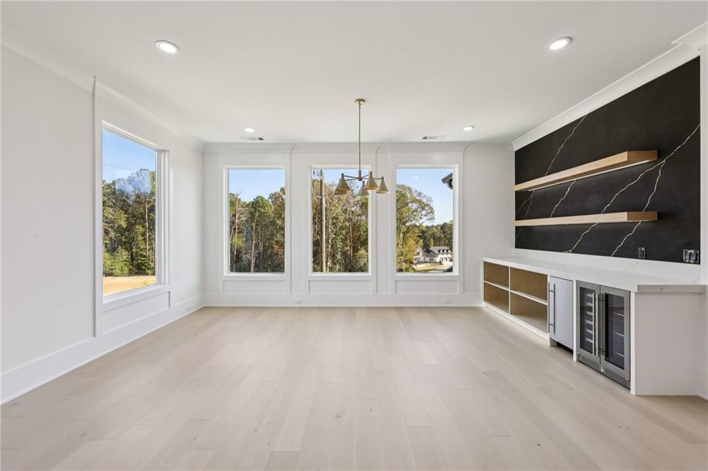 2395 Kilgore Road Buford, GA 30519 - Photo 13 of 68 a view of an empty room with a window and kitchen view