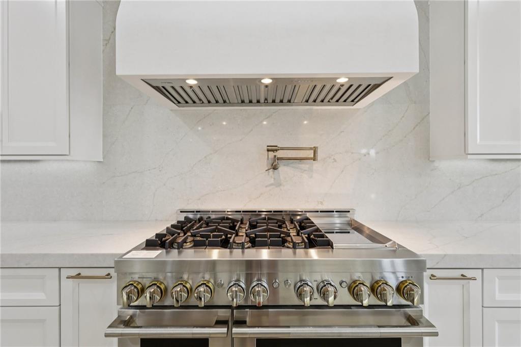 2395 Kilgore Road Buford, GA 30519 - Photo 17 of 68 a close view of a stove in the kitchen