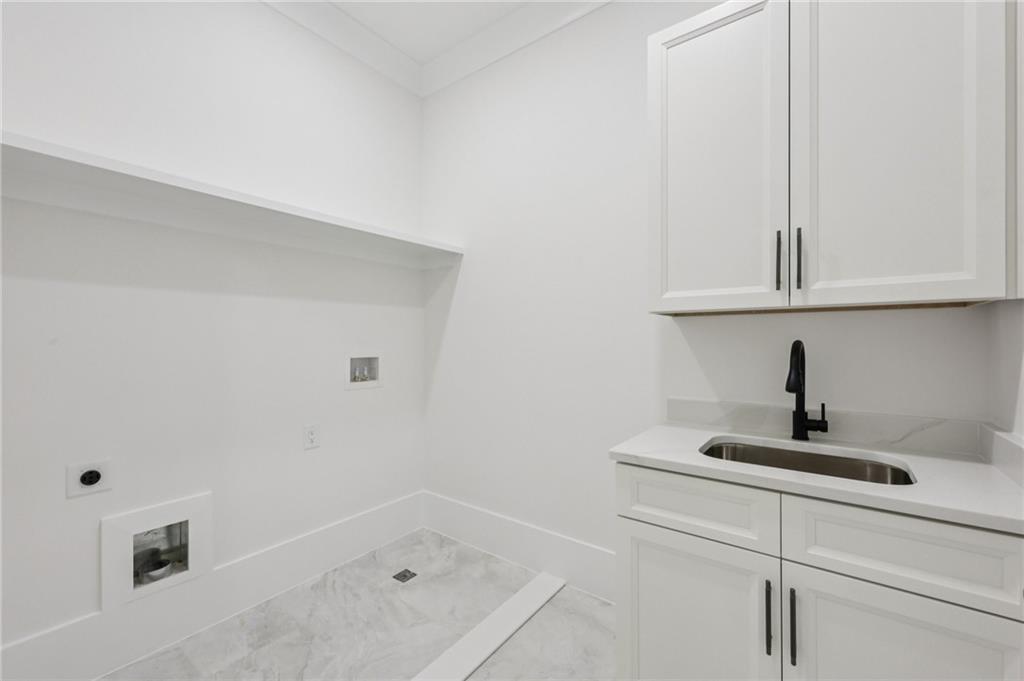2395 Kilgore Road Buford, GA 30519 - Photo 22 of 68 a bathroom with a sink and cabinets