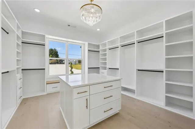 a view of a livingroom with an empty space and a window