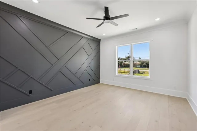 a bathroom with a sink a toilet a mirror and vanity