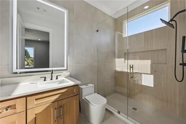 a view of an empty room with wooden walls