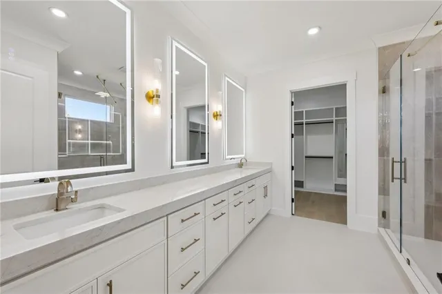 a kitchen with a sink and wooden floor
