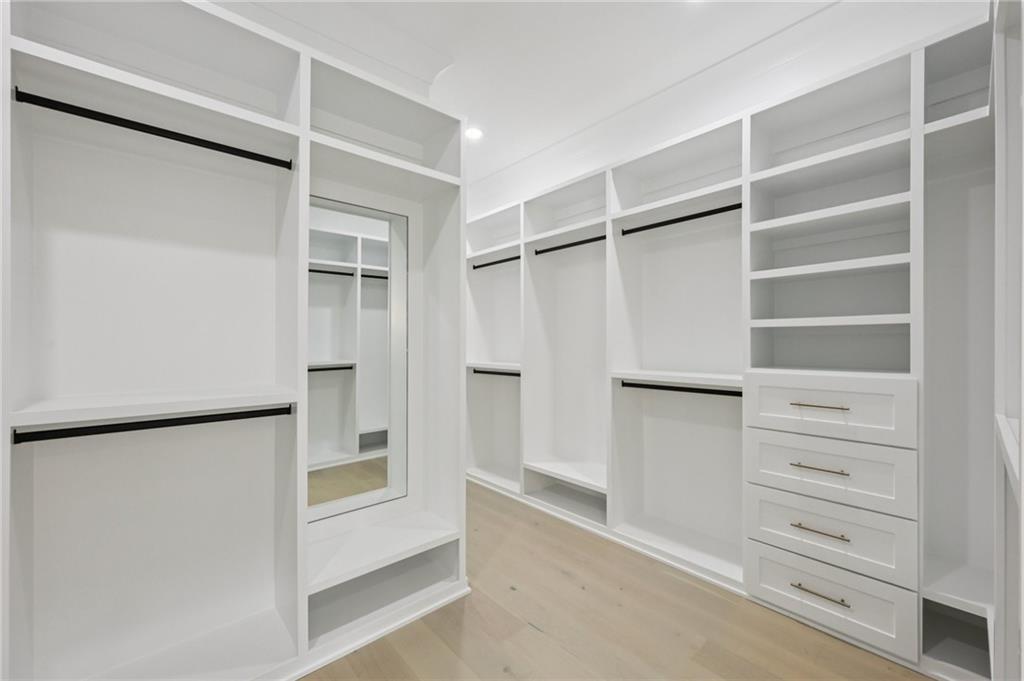 2395 Kilgore Road Buford, GA 30519 - Photo 43 of 68 a view of walk in closet with empty racks