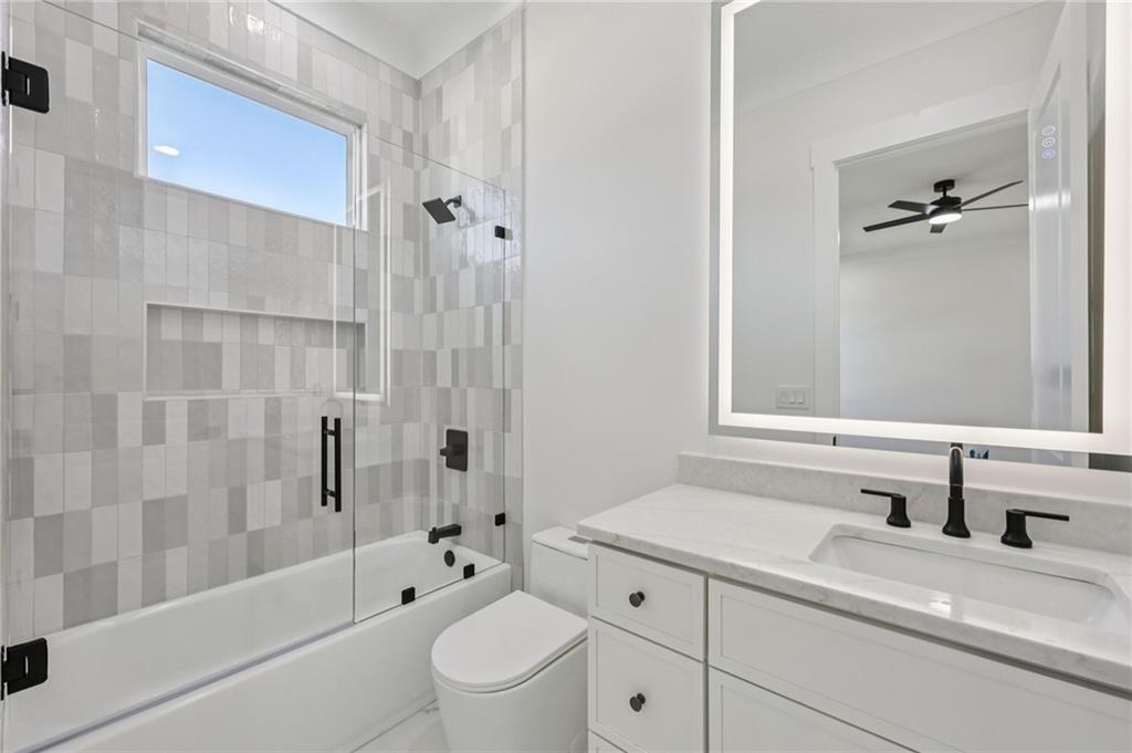 2395 Kilgore Road Buford, GA 30519 - Photo 49 of 68 a bathroom with a sink a toilet and shower