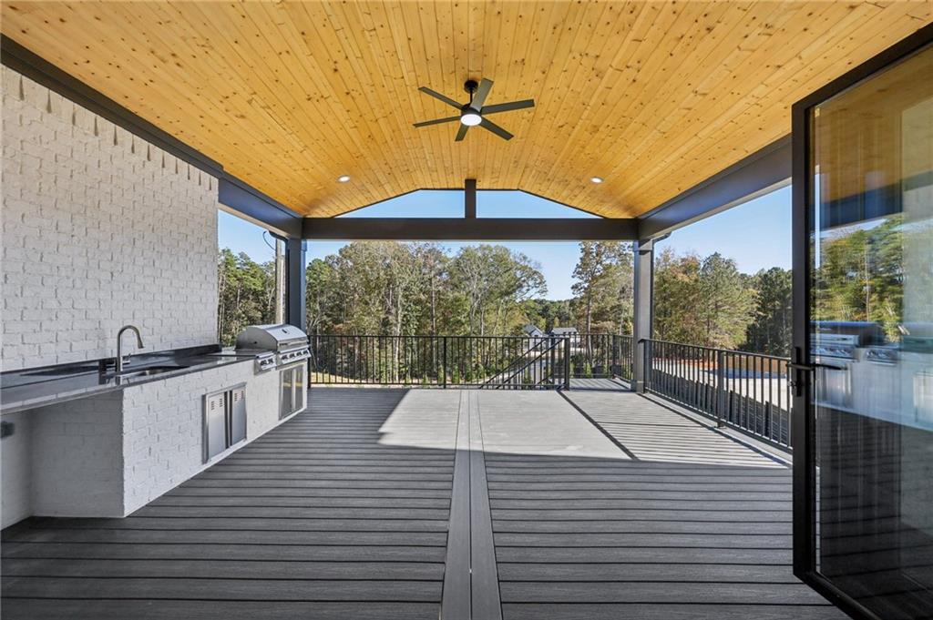 2395 Kilgore Road Buford, GA 30519 - Photo 55 of 68 a kitchen with a sink and wooden floor