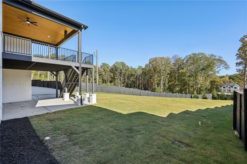 2395 Kilgore Road Buford, GA 30519 - Photo 57 of 68 a view of a house with pool and a yard