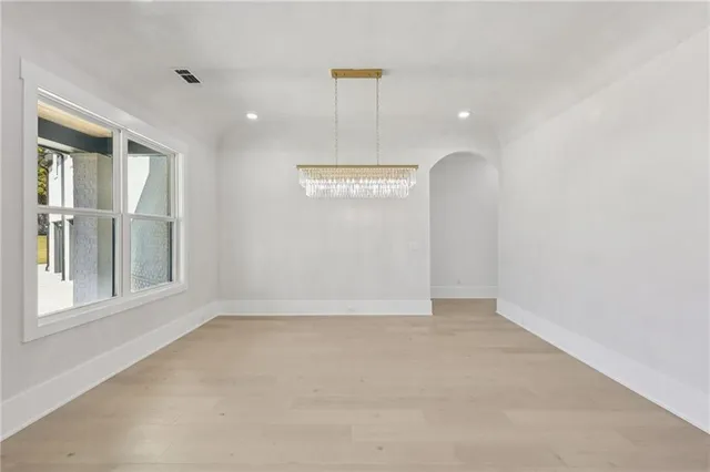 a view of an entryway with wooden floor and a window