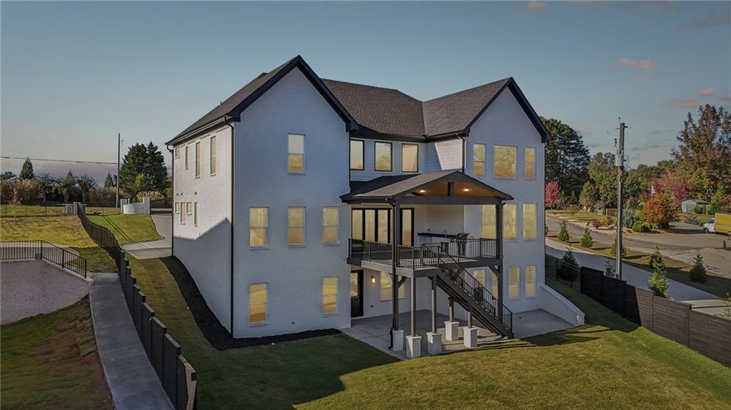 2395 Kilgore Road Buford, GA 30519 - Photo 68 of 68 a front view of a house with garden