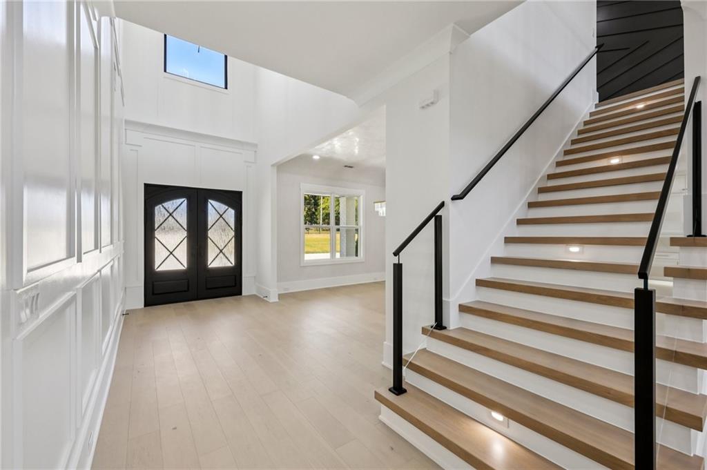 2395 Kilgore Road Buford, GA 30519 - Photo 7 of 68 a view of an entryway with wooden floor and a window