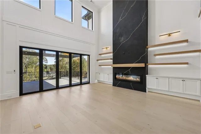 a view of a livingroom with an empty space and a fireplace