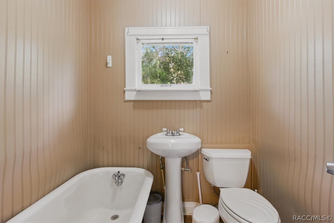 6 62nd Street Yankeetown, FL 34498 - Photo 47 of 55 a bathroom with a sink mirror and toilet