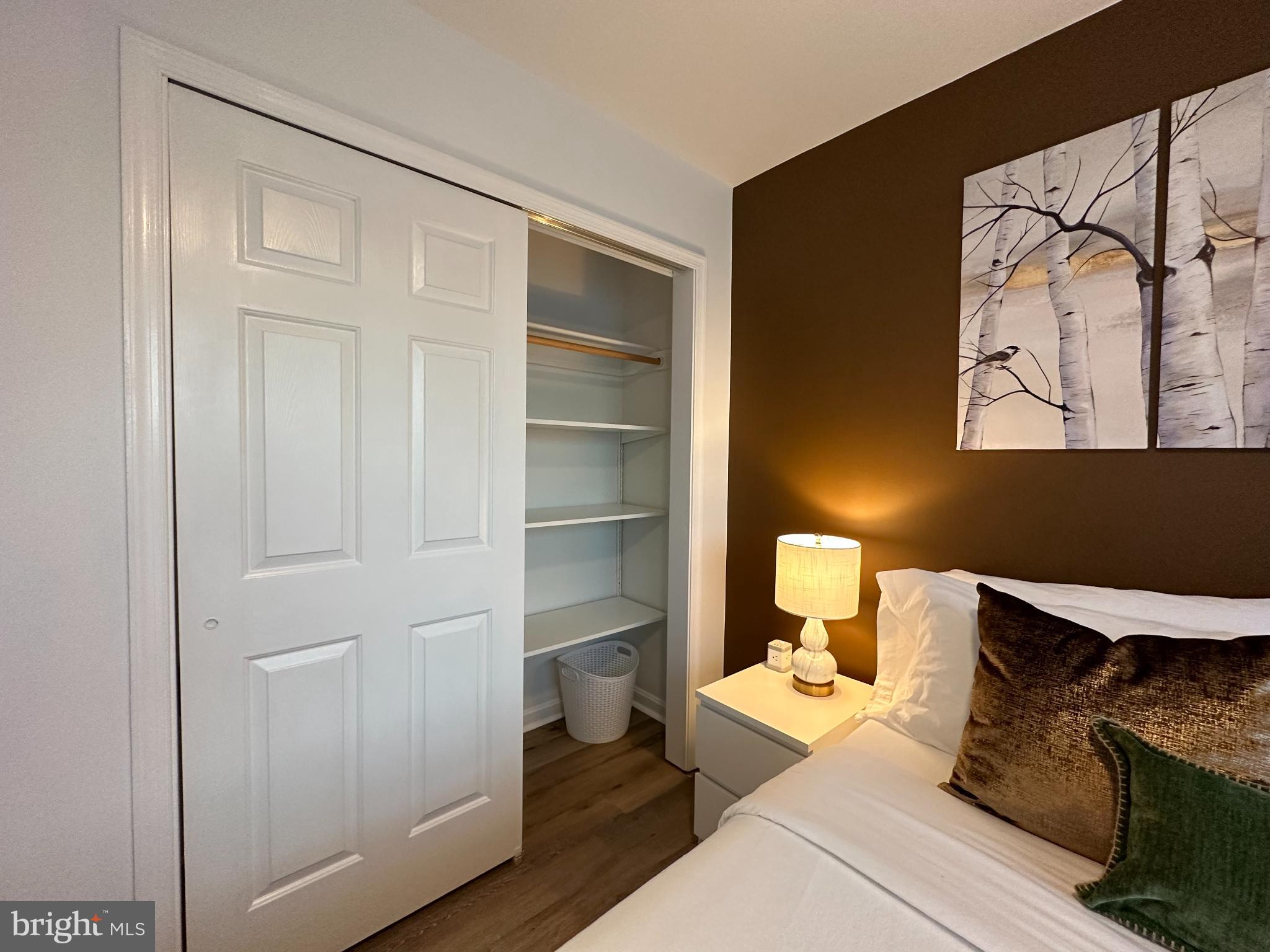 1221 Cox Neck Road Chester, MD 21619 - Photo 17 of 35 a living room with a bed furniture and a window