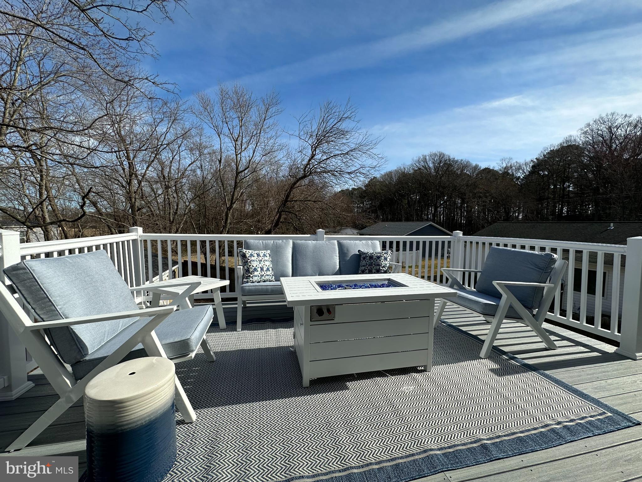 1221 Cox Neck Road Chester, MD 21619 - Photo 27 of 35 a view of balcony with wooden floor and outdoor seating