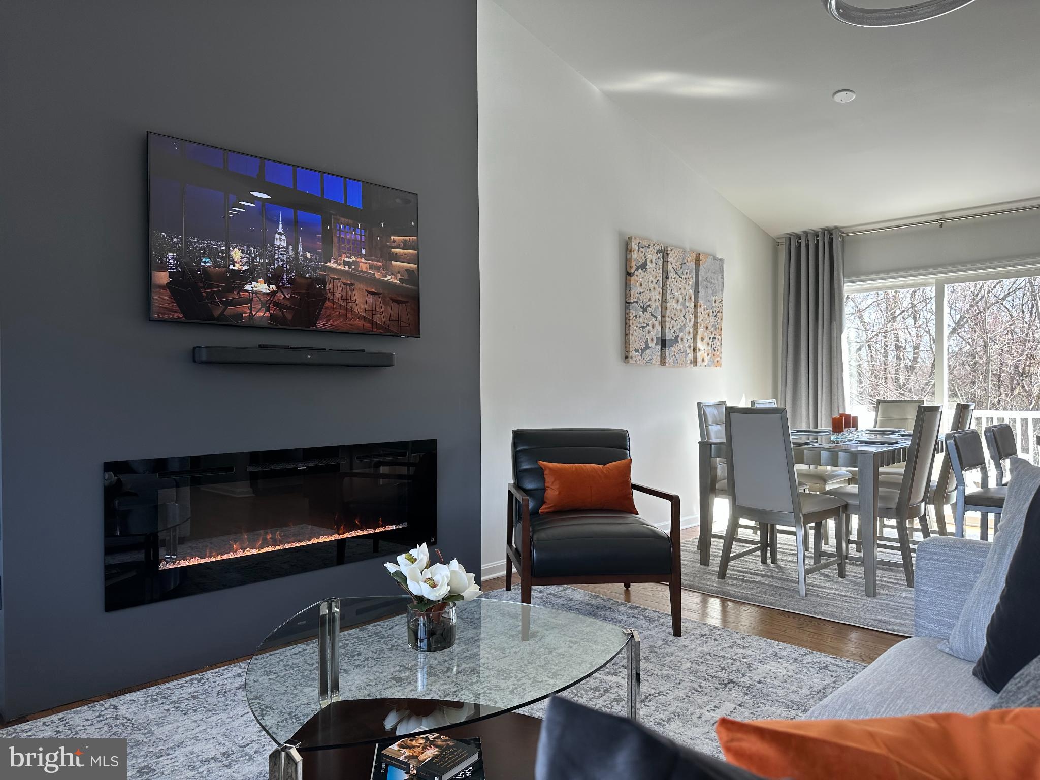 1221 Cox Neck Road Chester, MD 21619 - Photo 3 of 35 a living room with furniture a fireplace and a large window