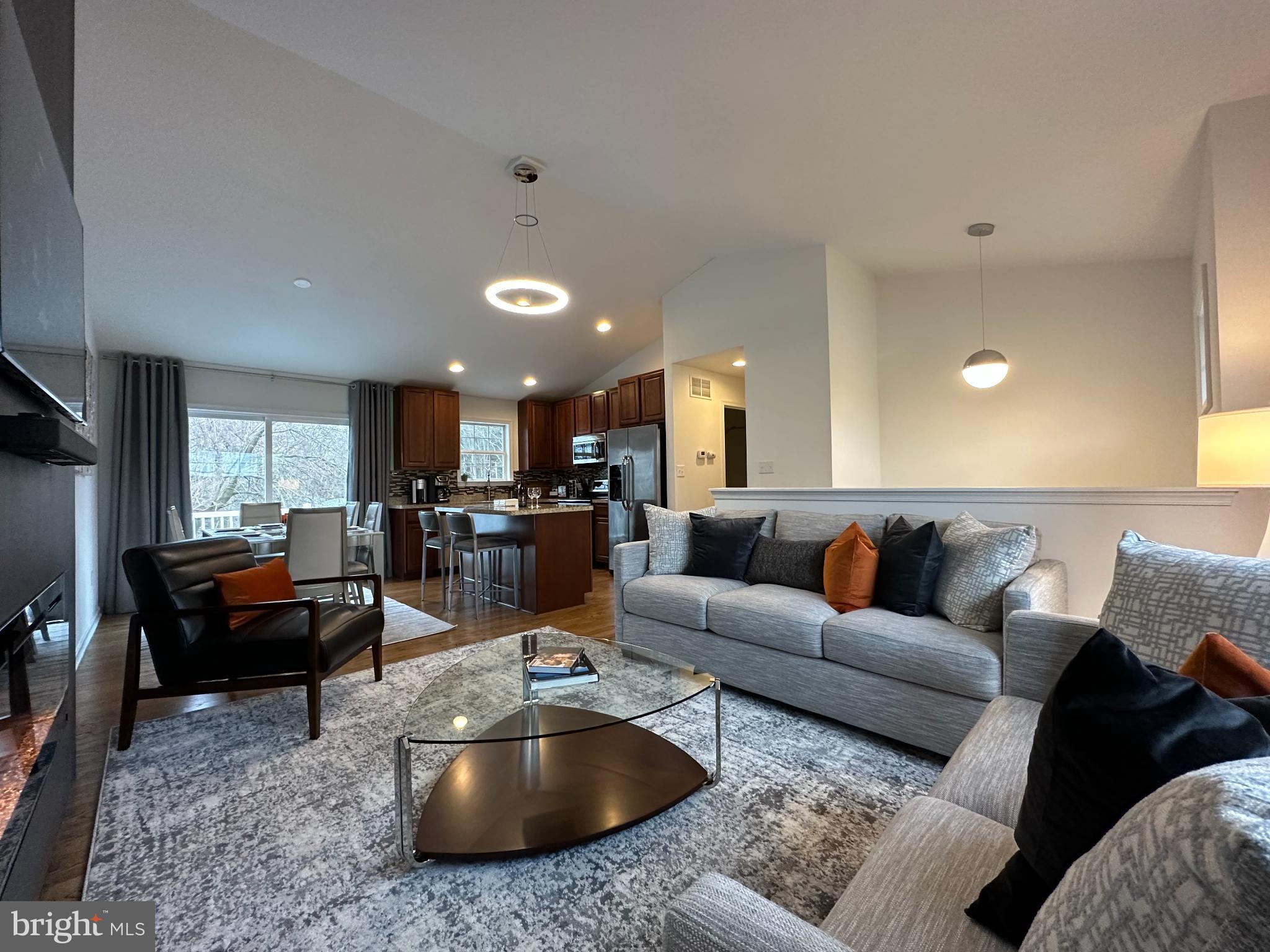 1221 Cox Neck Road Chester, MD 21619 - Photo 4 of 35 a living room with furniture kitchen view and a large window
