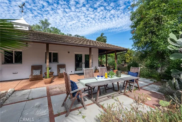 a bed room with a bed and a chair