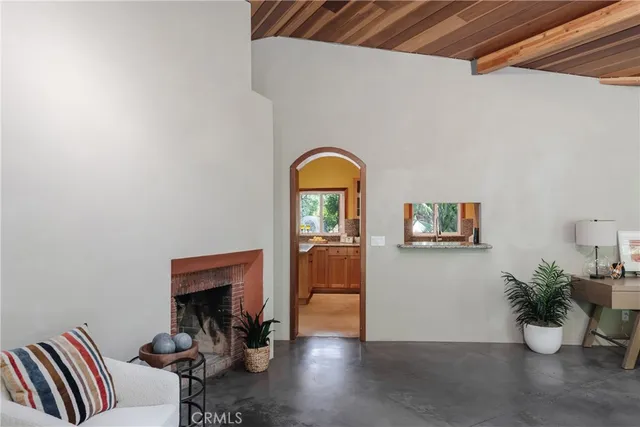 a bathroom with a granite countertop sink a mirror and a window