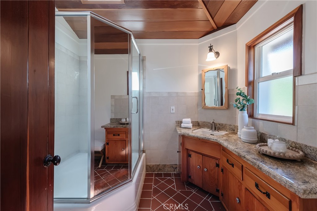 2 Chuckwagon Road Rolling Hills, CA 90274 - Photo 30 of 76 a spacious bathroom with a granite countertop sink and a mirror