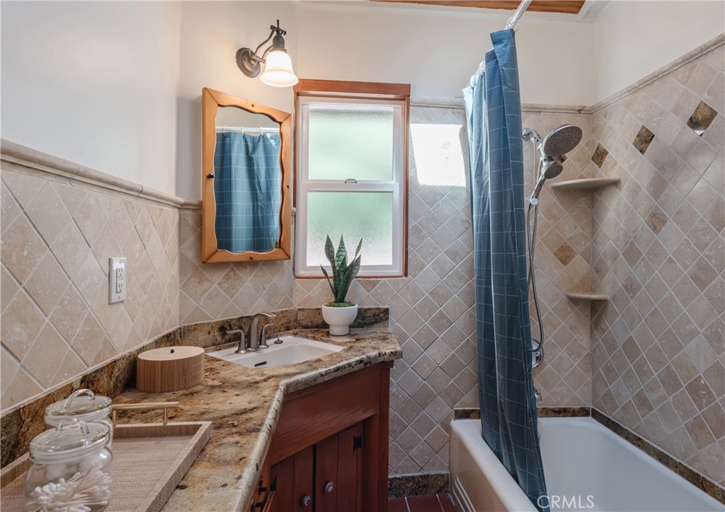 2 Chuckwagon Road Rolling Hills, CA 90274 - Photo 33 of 76 a bathroom with a granite countertop sink and a mirror